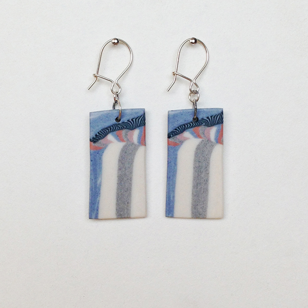 Grey. white, and blue striped earrings with Pink area.